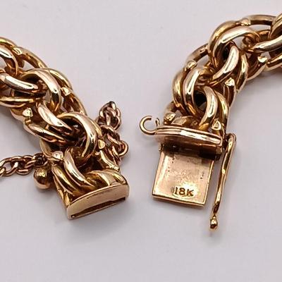 LOT 29: Stunning 18K Yellow Gold and Turquoise Charm Bracelet 32.9gtw