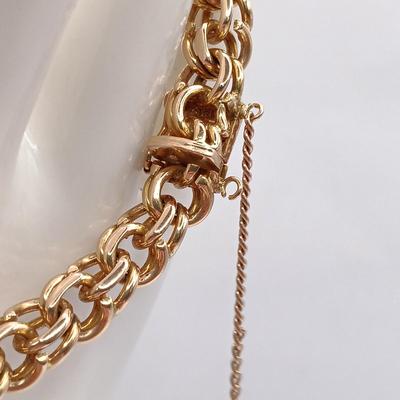 LOT 29: Stunning 18K Yellow Gold and Turquoise Charm Bracelet 32.9gtw