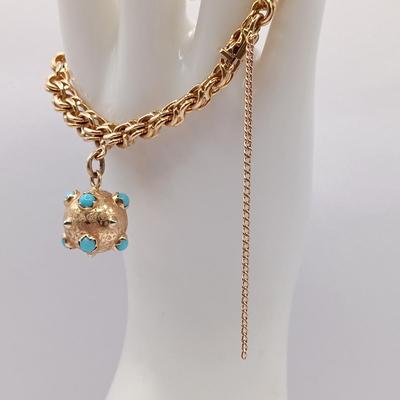 LOT 29: Stunning 18K Yellow Gold and Turquoise Charm Bracelet 32.9gtw