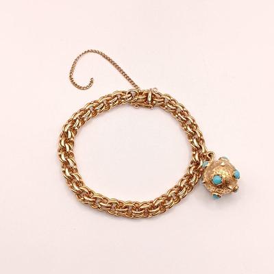 LOT 29: Stunning 18K Yellow Gold and Turquoise Charm Bracelet 32.9gtw