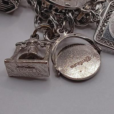 LOT 34: Vintage Sterling Silver Charm Bracelet Featuring 22 Charms and a Safety Chain 67.9gtw