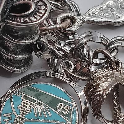 LOT 34: Vintage Sterling Silver Charm Bracelet Featuring 22 Charms and a Safety Chain 67.9gtw