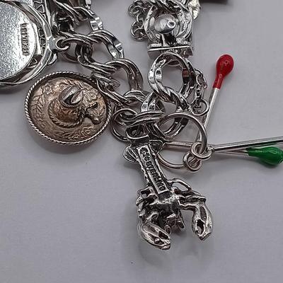 LOT 34: Vintage Sterling Silver Charm Bracelet Featuring 22 Charms and a Safety Chain 67.9gtw