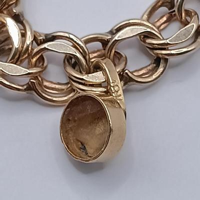 LOT 35: 14K Gold Charm Bracelet w/ 18K Corletto Blackamoor Pendant, 14K Carnelian Charm, 14K Handpainted Lady &Bead. 22.7gtw