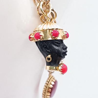LOT 35: 14K Gold Charm Bracelet w/ 18K Corletto Blackamoor Pendant, 14K Carnelian Charm, 14K Handpainted Lady &Bead. 22.7gtw