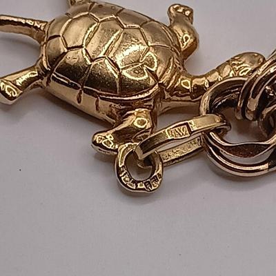 LOT 35: 14K Gold Charm Bracelet w/ 18K Corletto Blackamoor Pendant, 14K Carnelian Charm, 14K Handpainted Lady &Bead. 22.7gtw