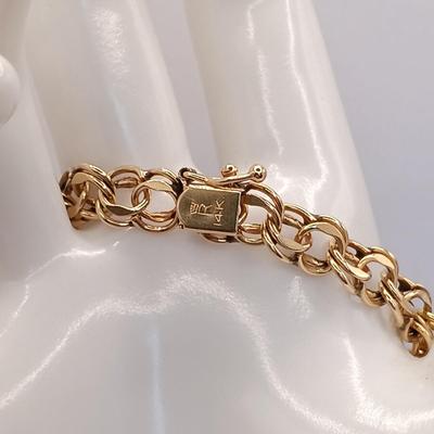 LOT 35: 14K Gold Charm Bracelet w/ 18K Corletto Blackamoor Pendant, 14K Carnelian Charm, 14K Handpainted Lady &Bead. 22.7gtw