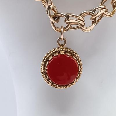 LOT 35: 14K Gold Charm Bracelet w/ 18K Corletto Blackamoor Pendant, 14K Carnelian Charm, 14K Handpainted Lady &Bead. 22.7gtw
