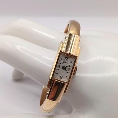 LOT 36: Geneve 750 18K Yellow Gold Hinged Bracelet Watch w/ Safety Chain 15.2gtw