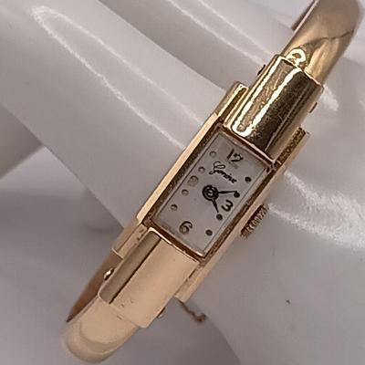 LOT 36: Geneve 750 18K Yellow Gold Hinged Bracelet Watch w/ Safety Chain 15.2gtw