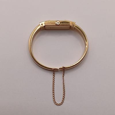 LOT 36: Geneve 750 18K Yellow Gold Hinged Bracelet Watch w/ Safety Chain 15.2gtw