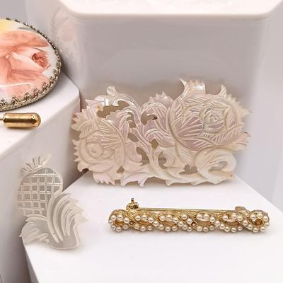 LOT 45: Vintage Brooches - Carved Mother of Pearl, Handpainted Ceramic, Moonstone on Silver-Tone Backing & More