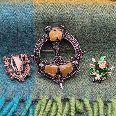 LOT 52: Collection of Irish Inspired Fashion Items Including (1) 12K Rolled Gold and (1) Silver Connemara Marble Brooches
