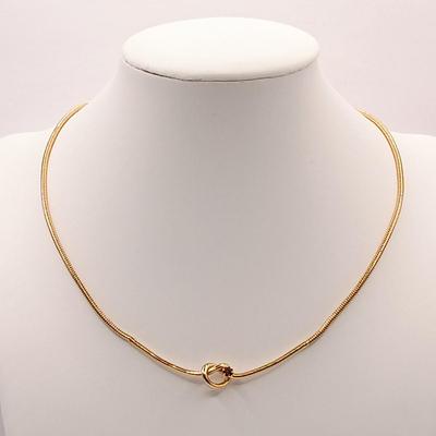 LOT 246: Collection of Faux Garnet and Gold-Tone Fashion Jewelry