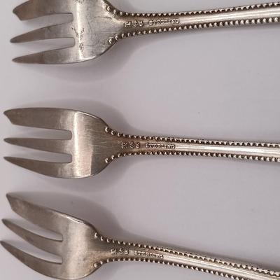 LOT 247: Set of 3 Sterling Silver Henry Kohn & Sons Cocktail Forks 40.32gtw with an Unmarked Silverplate and Shell Spoon