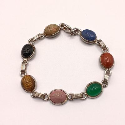 LOT 252: Silver-Tone Stone Scarab Bracelet, Napier Silver-Tone Hoop Earrings & More