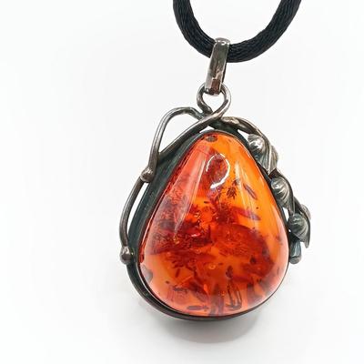 LOT 254: Baltic Amber and Sterling 2" Pendant on Silk Cord with Sterling and Amber Earrings