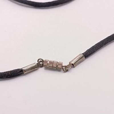 LOT 254: Baltic Amber and Sterling 2" Pendant on Silk Cord with Sterling and Amber Earrings