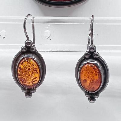 LOT 254: Baltic Amber and Sterling 2" Pendant on Silk Cord with Sterling and Amber Earrings