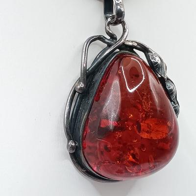 LOT 254: Baltic Amber and Sterling 2" Pendant on Silk Cord with Sterling and Amber Earrings