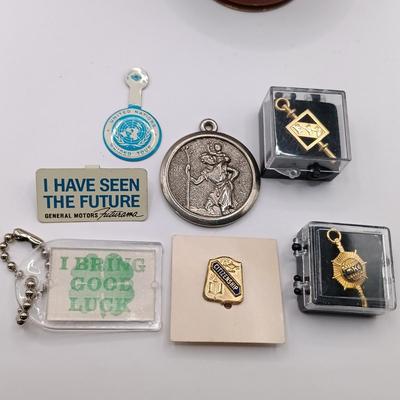 LOT 257: Etienne Aigner Designer Pen, Philadelphia Gas Works Sterling Pendant and Pin, World's Fair Ford Motor Clip & More