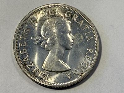 1958 Elizabeth II Canadian Totem Pole Silver Dollar (British Columbia) in Choice BU Condition as Pictured. FREE DOMESTIC SHIPPING.