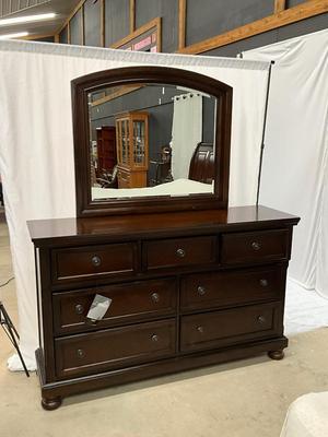Lot P 634 Porter Rustic Brown Seven Drawer Dresser with Beveled Mirror