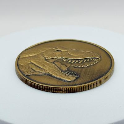 LOT 116J: 1999 Universal Studios Islands of Adventure Jurassic Park Dinosaur Coin Medallion in Original Box