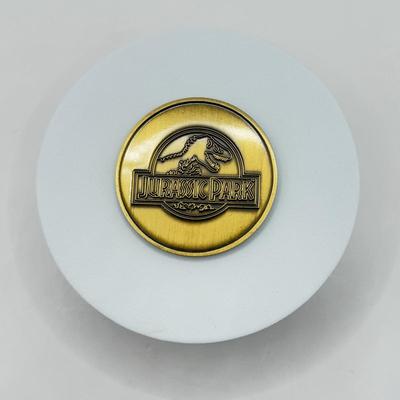 LOT 116J: 1999 Universal Studios Islands of Adventure Jurassic Park Dinosaur Coin Medallion in Original Box