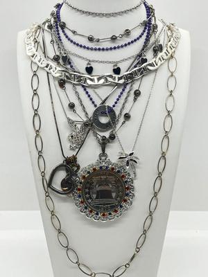LOT 183J: Eclectic Silvertone Necklace Collection: Playboy Bunny, Rod Stewart, Liberty Bell and More