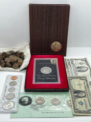 LOT 221J: US Currency Collection: 1957 $1 Silver Certificate, 1980 Susan B. Anthony Souvenir Set, 1997 Coin Set, Bag of Wheat Pennies