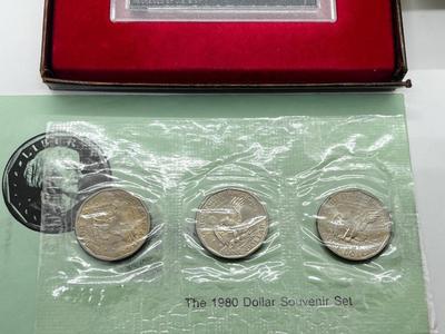 LOT 221J: US Currency Collection: 1957 $1 Silver Certificate, 1980 Susan B. Anthony Souvenir Set, 1997 Coin Set, Bag of Wheat Pennies