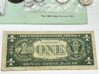 LOT 221J: US Currency Collection: 1957 $1 Silver Certificate, 1980 Susan B. Anthony Souvenir Set, 1997 Coin Set, Bag of Wheat Pennies