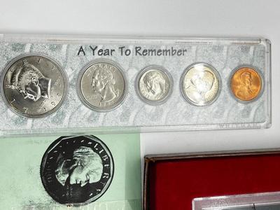 LOT 221J: US Currency Collection: 1957 $1 Silver Certificate, 1980 Susan B. Anthony Souvenir Set, 1997 Coin Set, Bag of Wheat Pennies