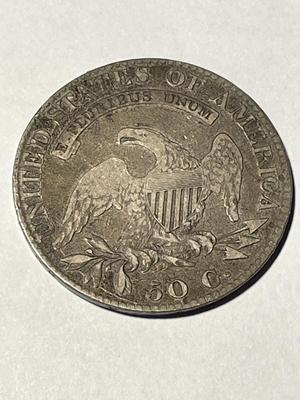 DOUBLE PROFILE 1823 CAPPED BUST HALF DOLLAR AS PICTURED PREOWNED FROM AN ESTATE. FREE DOMESTIC SHIPPING.
