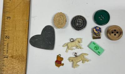 Sale Photo Thumbnail #438: Includes Buttons, CSEA 10-Year Service Lapel Pin, Winnie the Pooh charm, 2 horse charms, a heart-shaped mirror, and a Girl Scout Cookie LEGO.