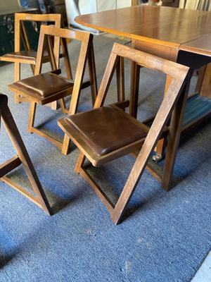 MID-CENTURY GATELEG DINING TABLE WITH 4 FOLDING CHAIRS STORED INSIDE THE TABLE