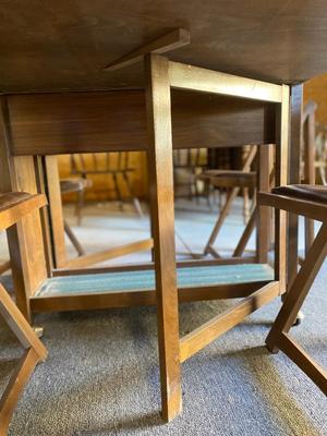 MID-CENTURY GATELEG DINING TABLE WITH 4 FOLDING CHAIRS STORED INSIDE THE TABLE