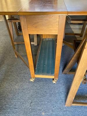 MID-CENTURY GATELEG DINING TABLE WITH 4 FOLDING CHAIRS STORED INSIDE THE TABLE