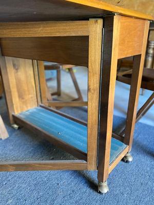 MID-CENTURY GATELEG DINING TABLE WITH 4 FOLDING CHAIRS STORED INSIDE THE TABLE