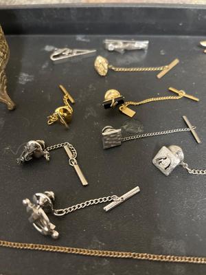 Tie clasps, clips, lapel pins and dresser jar