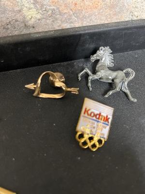 Tie clasps, clips, lapel pins and dresser jar