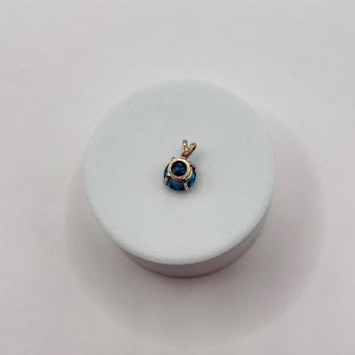 LOT 82J: 14k White Gold Teal Blue Topaz Pendant (1.2gtw)