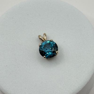 LOT 82J: 14k White Gold Teal Blue Topaz Pendant (1.2gtw)