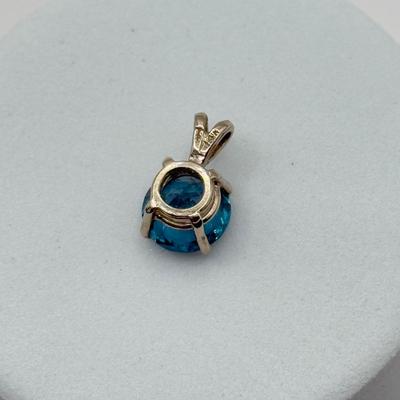 LOT 82J: 14k White Gold Teal Blue Topaz Pendant (1.2gtw)
