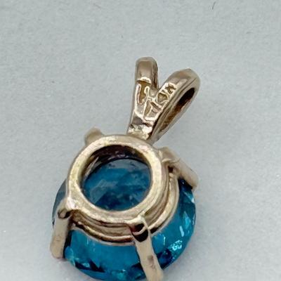 LOT 82J: 14k White Gold Teal Blue Topaz Pendant (1.2gtw)