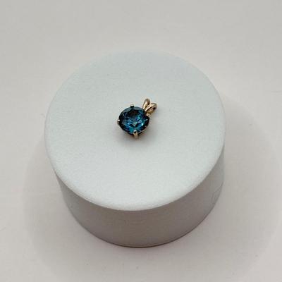 LOT 82J: 14k White Gold Teal Blue Topaz Pendant (1.2gtw)