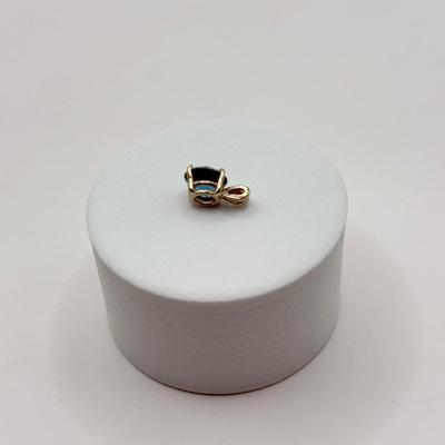 LOT 82J: 14k White Gold Teal Blue Topaz Pendant (1.2gtw)