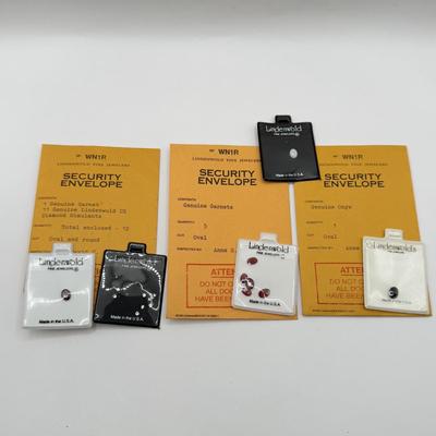 LOT 106J: Lindenwold Jewelers Loose Stones in Package - Garnet, Onyx, Cubic Zirconia