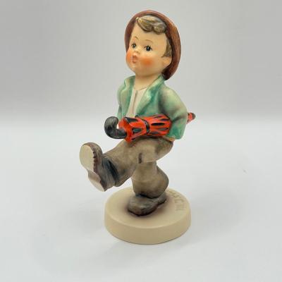 LOT 136K: Vintage Goebel MI Hummel Porcelain Figurines - "Little Gabriel" 32/0, "Happy Traveler" 109/0 &...